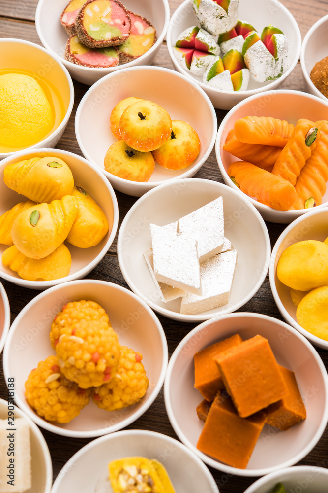 Rangoli of Assorted Indian sweets/mithai in bowl for Diwali or any other festivals, selective focus Rangoli of Assorted Indian sweets/mithai in bowl for Diwali or any other festivals, selective focus