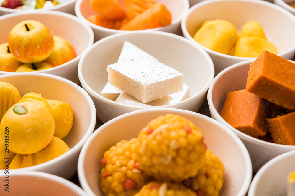 Rangoli of Assorted Indian sweets/mithai in bowl for Diwali or any other festivals, selective focus Rangoli of Assorted Indian sweets/mithai in bowl for Diwali or any other festivals, selective focus