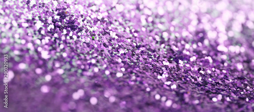 Violet glitter shine dots confetti. Abstract light blur blink sparkle defocus background.