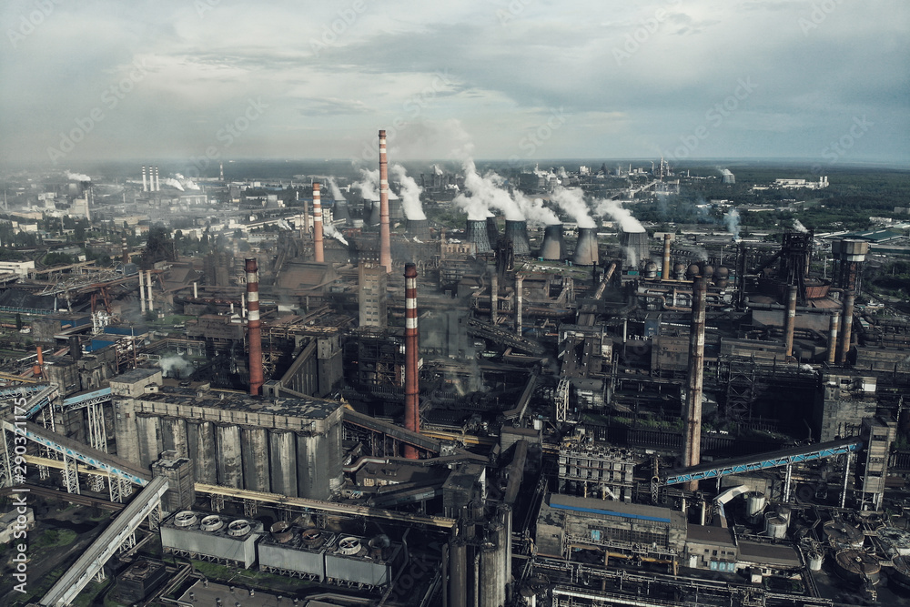 Heavy industry of Metallurgical Production industry landscape from drone. Smoke from chimneys, global warming concept