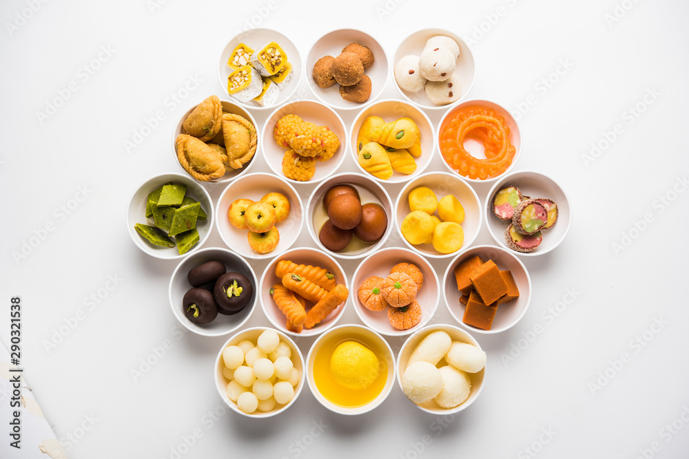 Rangoli of Assorted Indian sweets/mithai in bowl for Diwali or any other festivals, selective focus Rangoli of Assorted Indian sweets/mithai in bowl for Diwali or any other festivals, selective focus