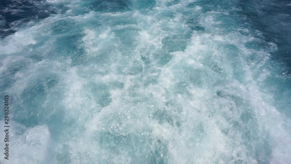 A water trail is formed using a boat. A water trail foams behind a boat sailing on the sea.1920X1080 Full Hd. A water trail is formed using a boat. A water trail foams behind a boat sailing on the sea.1920X1080 Full Hd.