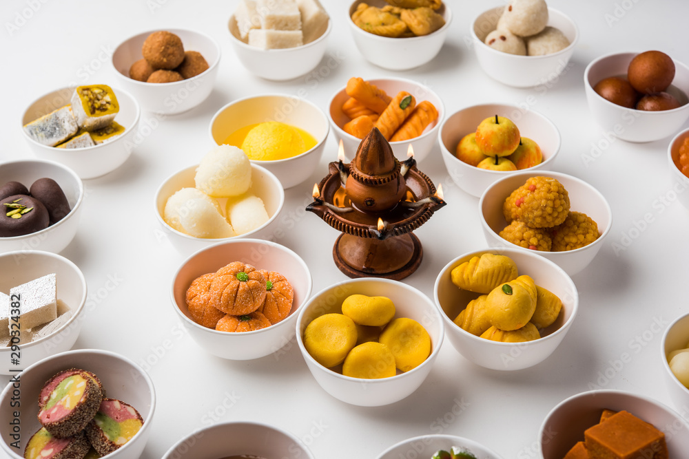 Rangoli of Assorted Indian sweets/mithai in bowl for Diwali or any other festivals, selective focus