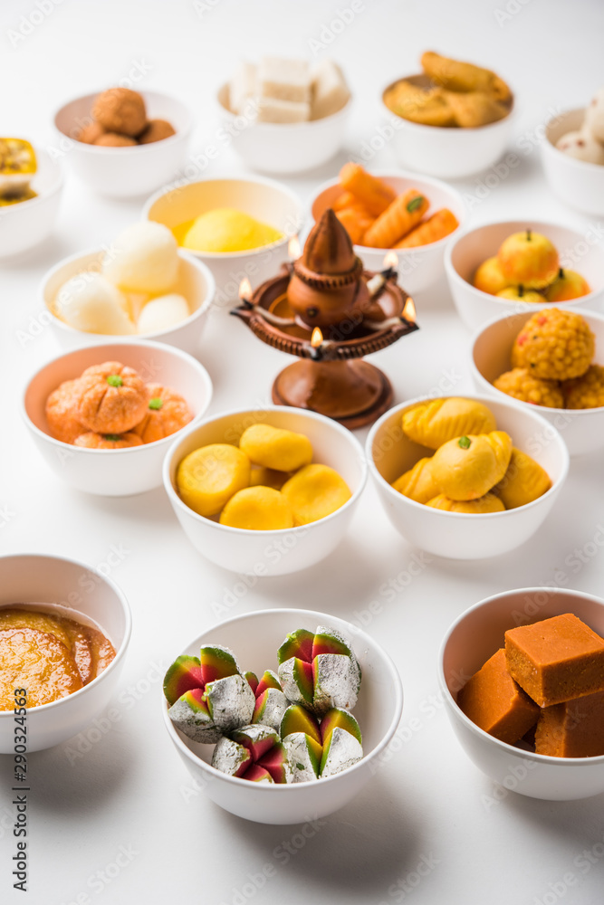 Rangoli of Assorted Indian sweets/mithai in bowl for Diwali or any other festivals, selective focus Rangoli of Assorted Indian sweets/mithai in bowl for Diwali or any other festivals, selective focus