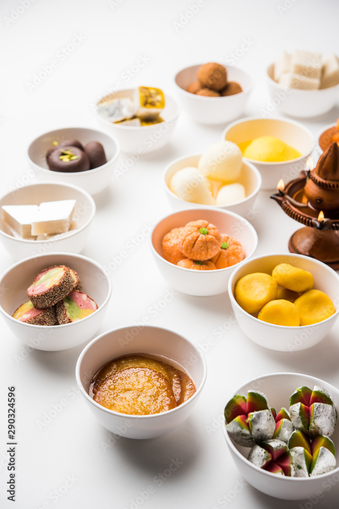 Rangoli of Assorted Indian sweets/mithai in bowl for Diwali or any other festivals, selective focus Rangoli of Assorted Indian sweets/mithai in bowl for Diwali or any other festivals, selective focus