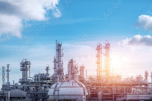 Manufacturing of petrochemical industrial or Oil and gas refinery plant with sunset sky photo