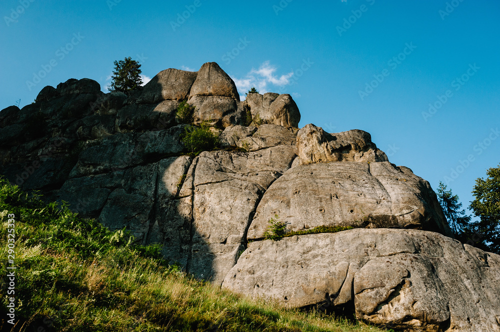 Big rock mountains. Mountain. Landscape with forest and stones. Blue Cloudy Sky. nature. Place for text.