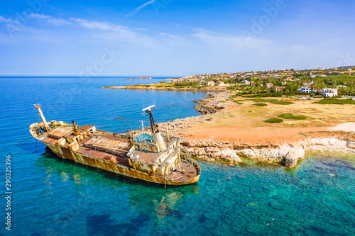 Cyprus. Pathos. White stone. Shipwreck. The ship ran aground top view. The ship crashed on the coastal rocks. Rusty ship at the shore of the Mediterranean sea. Tourist attractions of Cyprus.