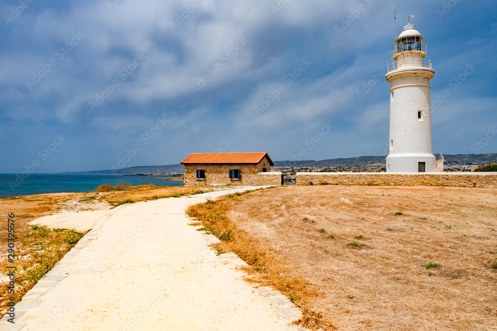 Cyprus. Pathos. Paphos lighthouse on the Mediterranean coast. The white lighthouse and the caretaker's house. Attractions Of Paphos. Travelling to Cyprus.