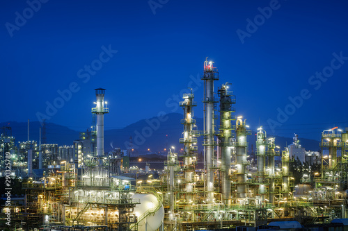 Oil and gas refinery plant or Petrochemical industrial plant on blue sky twilight background, Factory of petroleum with dawn sky