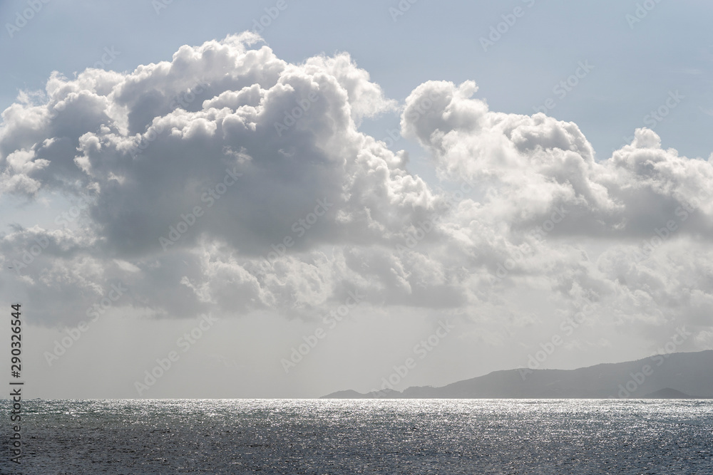 Blue sky with clouds over sea water. Nature composition.