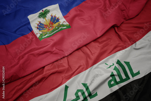 waving colorful flag of iraq and national flag of haiti.