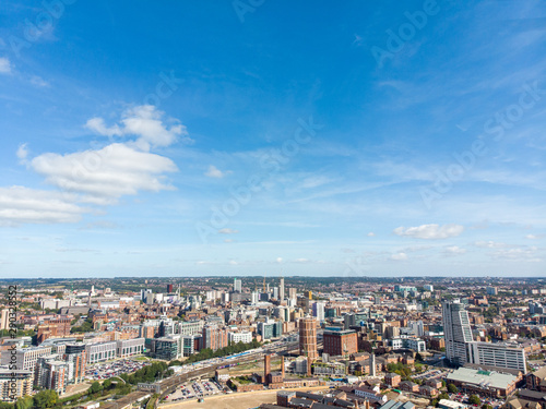 Fototapeta Naklejka Na Ścianę i Meble -  Aerial photo of the British town of Leeds in West Yorkshire UK, showing the Leeds City Centre taken with with a drone on a bright sunny day in the town of Holbeck near to the centre.