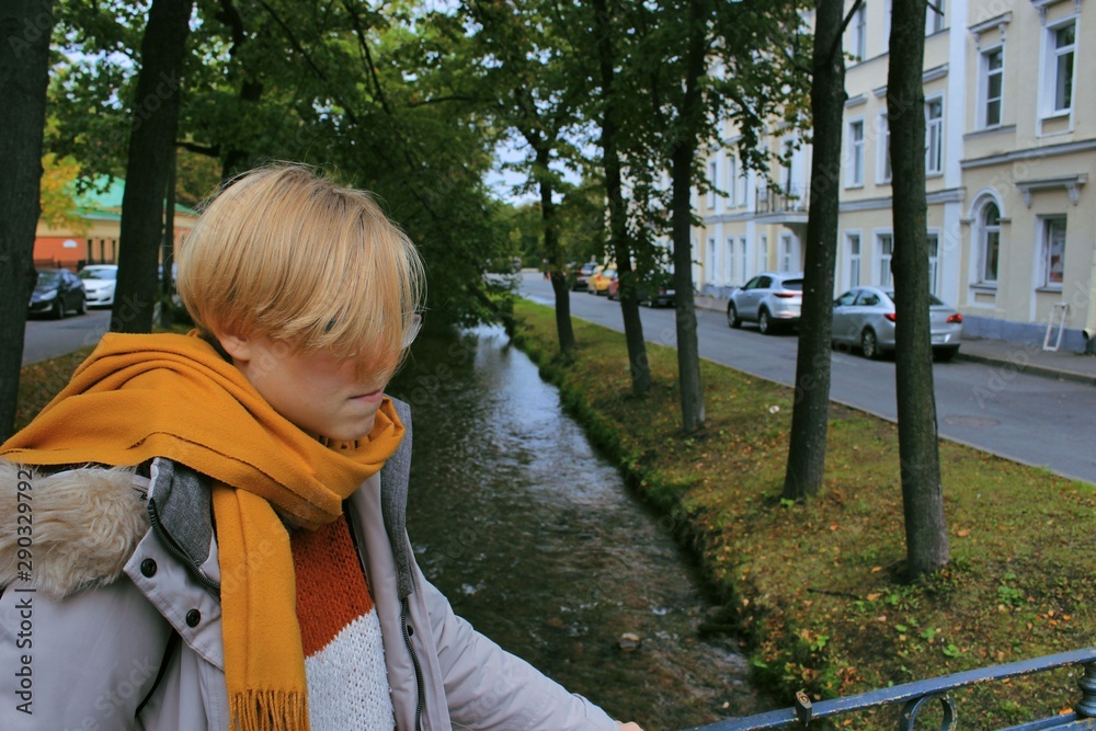 Young girl walks in the autumn park Young girl walks in the autumn park