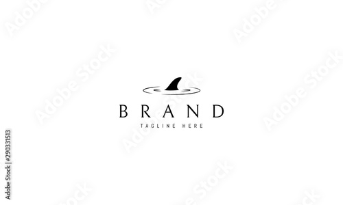 Vector logo on which an abstract image of a shark fin.