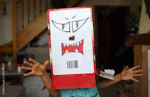 A child shows a self-made monster mask