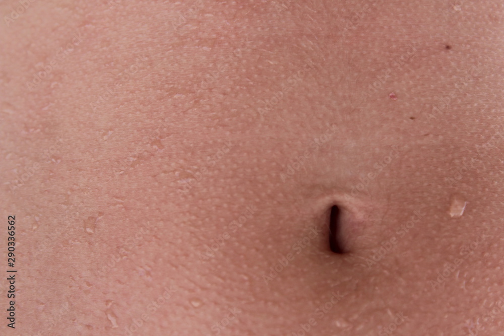 Fototapeta premium Close up. Navel. The bottom girl's belly