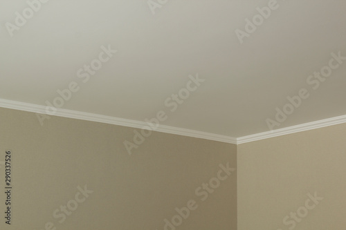 White plinth on the ceiling of drywall. photo