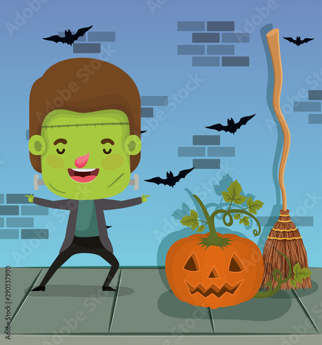halloween season scene with kid costume frankenstein