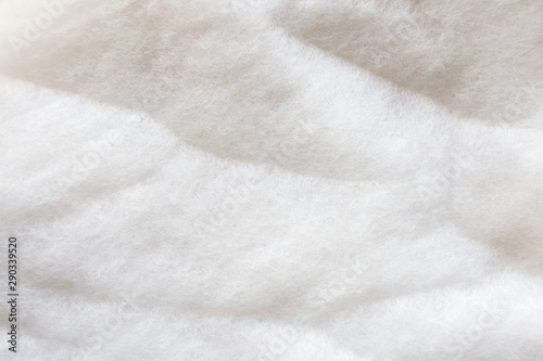 The texture of a white padding polyester. Syntepon- insulation material for clothes