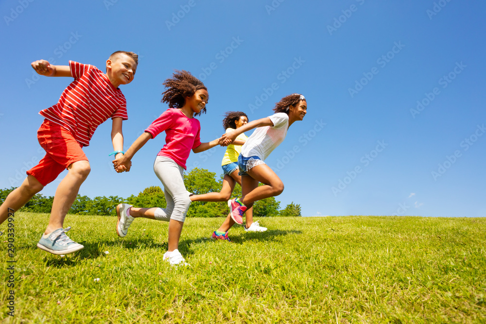 kids run very fast in the park holding hands smile kids run very fast in the park holding hands smile
