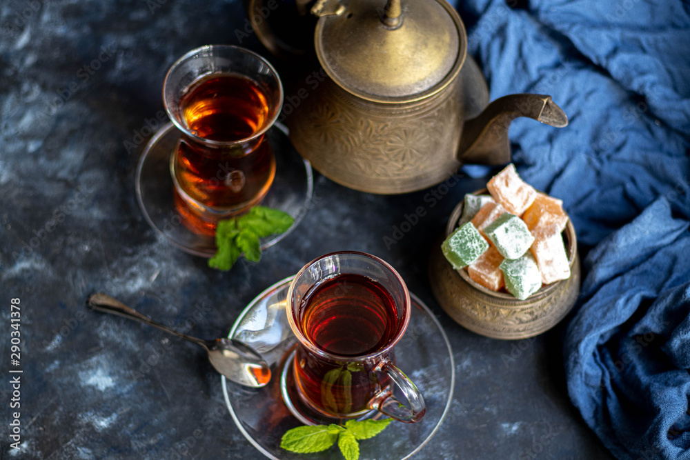 Ginger tea with lemon. Promotes weight loss. Heals colds. Nearby lies a fresh root and lime green. Ginger tea with lemon. Promotes weight loss. Heals colds. Nearby lies a fresh root and lime green.