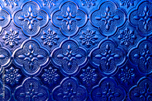 Blue embossed frosted glass, retro glass window craft, close up glass background.