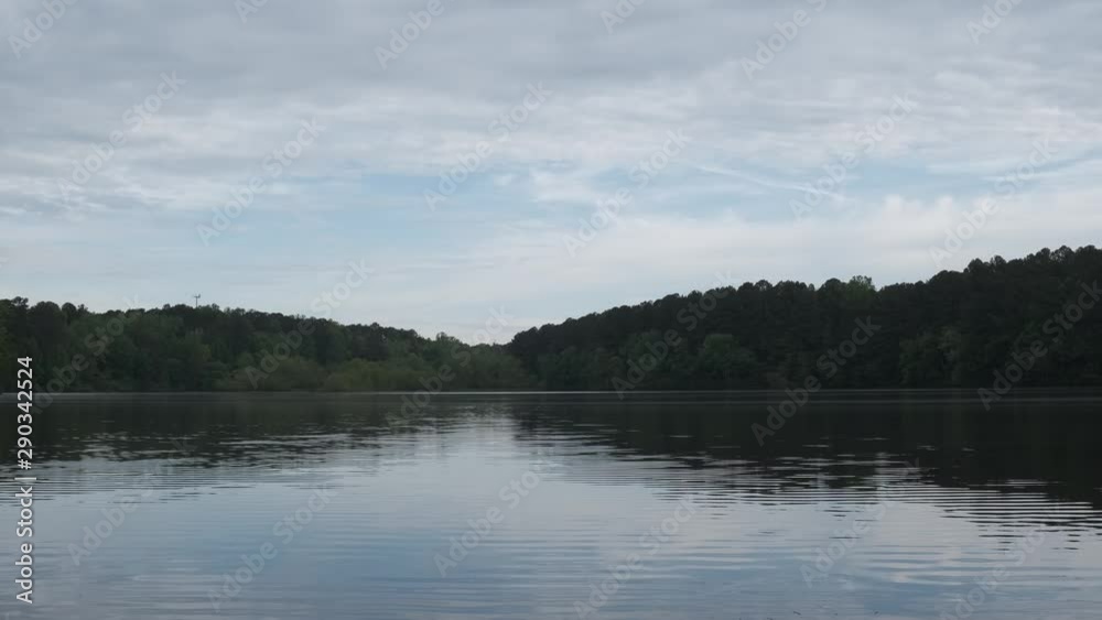 Early morning view across Lake Johnson, a popular recreation spot in Raleigh, North Carolina Early morning view across Lake Johnson, a popular recreation spot in Raleigh, North Carolina