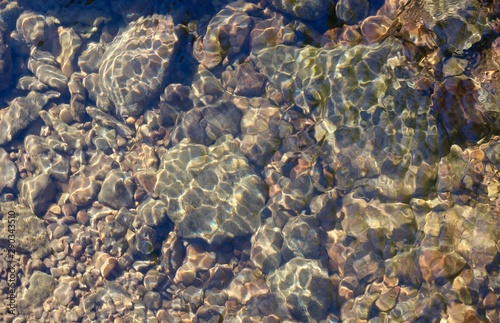 The rocks and the stone in the ripples of the clear water. © Al
