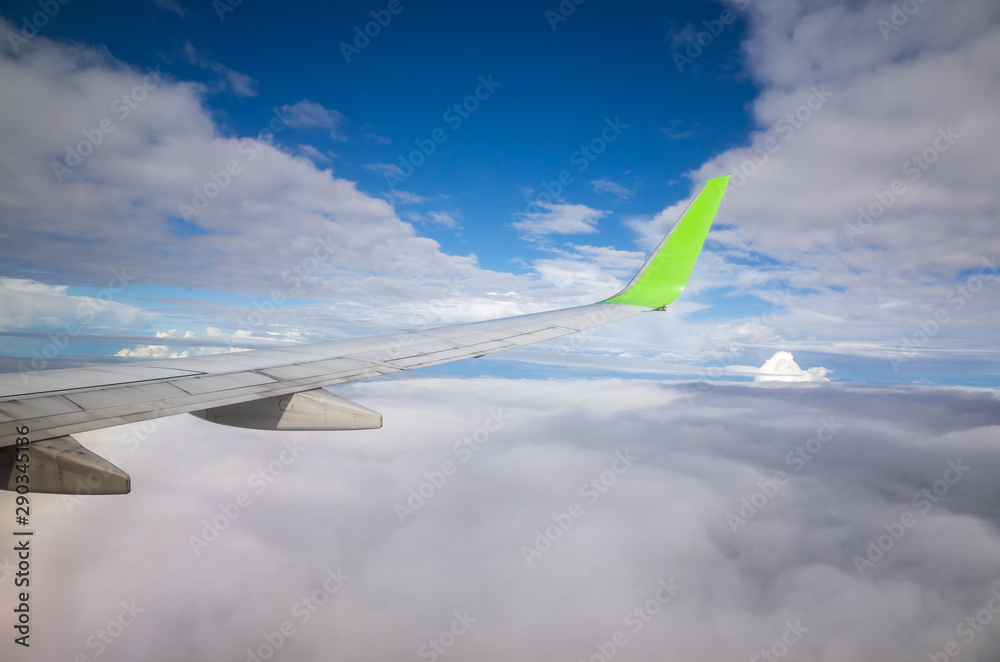 View from airplane window over cloud sky View from airplane window over cloud sky