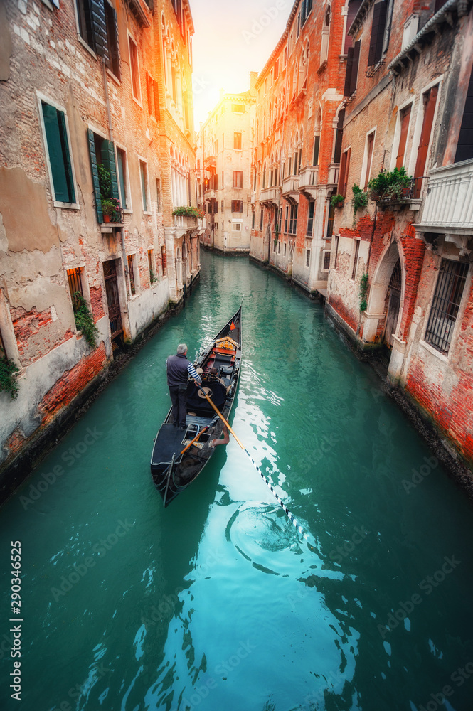 Venice, Italy - 25 October, 2017:  narrow old streets and famous gondola on  Grand Canal.