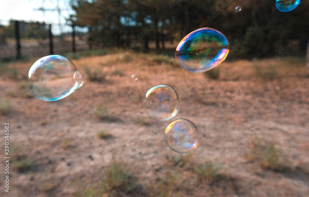 soap bubbles into the sunset with beautiful bokeh.close-up soap bubbles into the sunset with beautiful bokeh.close-up