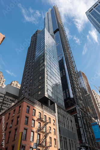 modern business building in manhattan on a sunny day cloud bluesky construction architecture financial center bank