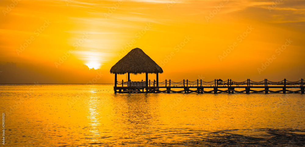 beautiful orange sunset on the sea with a pier beautiful orange sunset on the sea with a pier