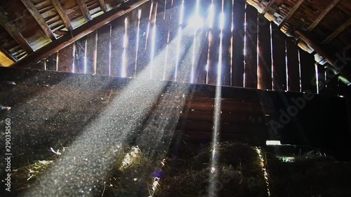 Sunlight penetrates through the gaps of the boards of the old barn HD 1920x1080