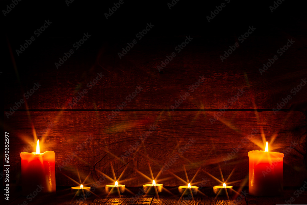 Candles on wooden background