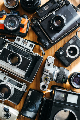 top view of a lot of of vintage cameras
