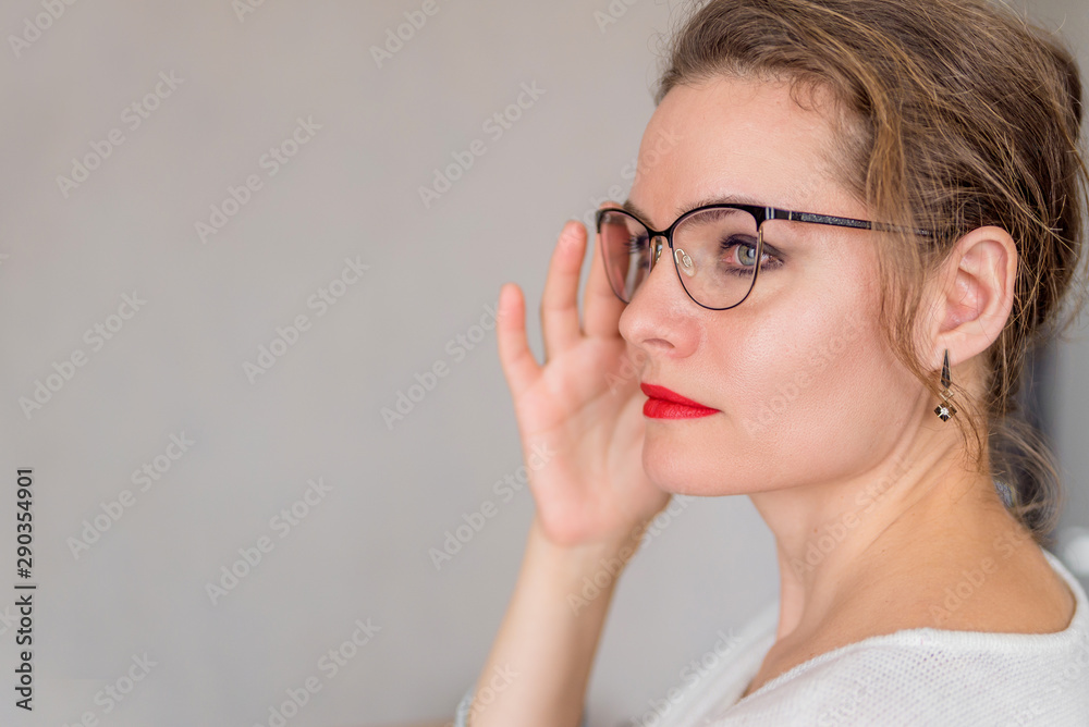portrait of an attractive adult woman with glasses on a white background copy space portrait of an attractive adult woman with glasses on a white background copy space
