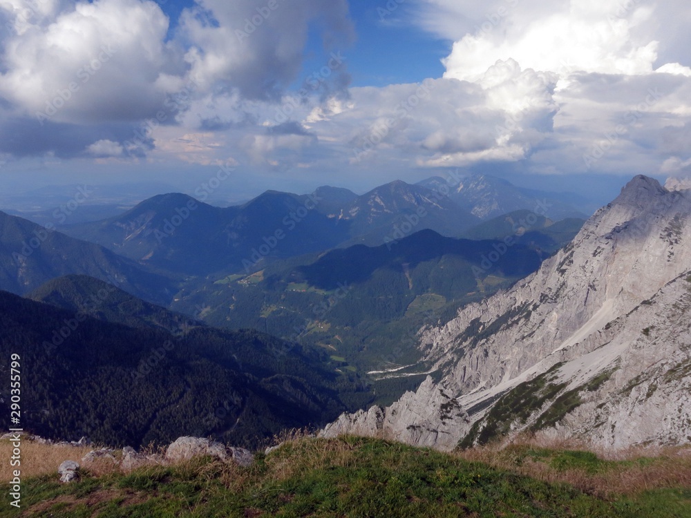 The view from Kofce Gora and Veliki vrh in Slovenia on Julian Alps (Southern Limestone Alps) on a beautiful sunny afternoon in July