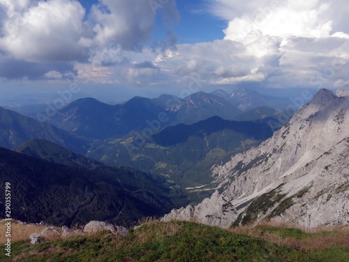 The view from Kofce Gora and Veliki vrh in Slovenia on Julian Alps (Southern Limestone Alps) on a beautiful sunny afternoon in July