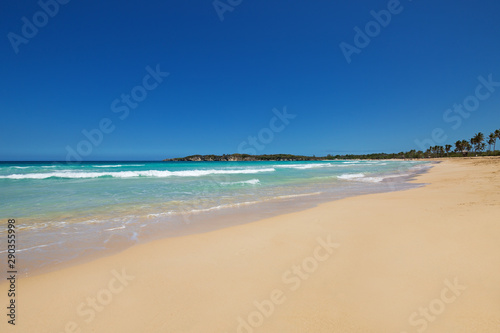 Playa Macao at sunny day, sandy beach and ocean waves © photopixel