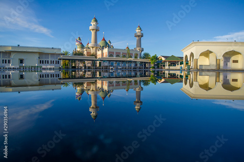 Beautiful central mosque and reflection in water at Pattani Central Mosque Thailand photo