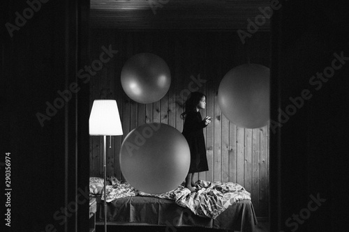 Little girl and spheres photo