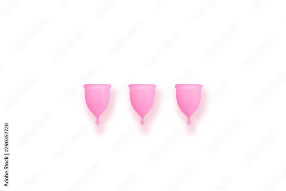 Pink menstrual cup on pink background. Flat lay, top view. copy space.