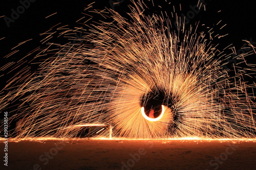 Koh Samet, Rayong, Thailand, 17 April 2019, beautiful fire circle spining show talent at night party beach island in thailand