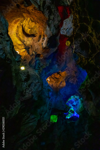 Beautiful illuminated multicolored stalactites in Danzhou Stone Flower Caves, Geopark next to Haikou, Hainan, China © dtatiana