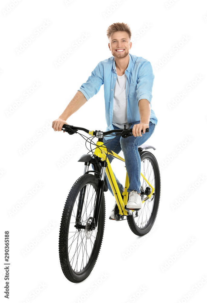 Handsome young man riding bicycle on white background