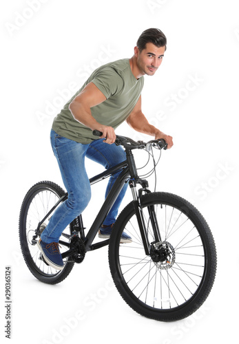 Handsome young man with modern bicycle on white background