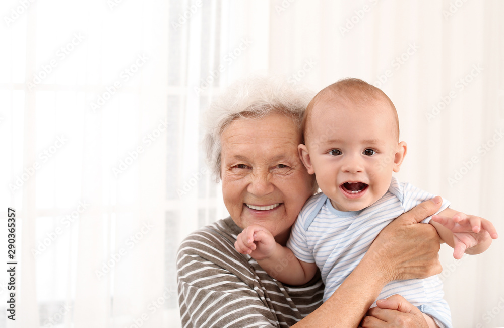 Happy grandmother with little baby at home Happy grandmother with little baby at home
