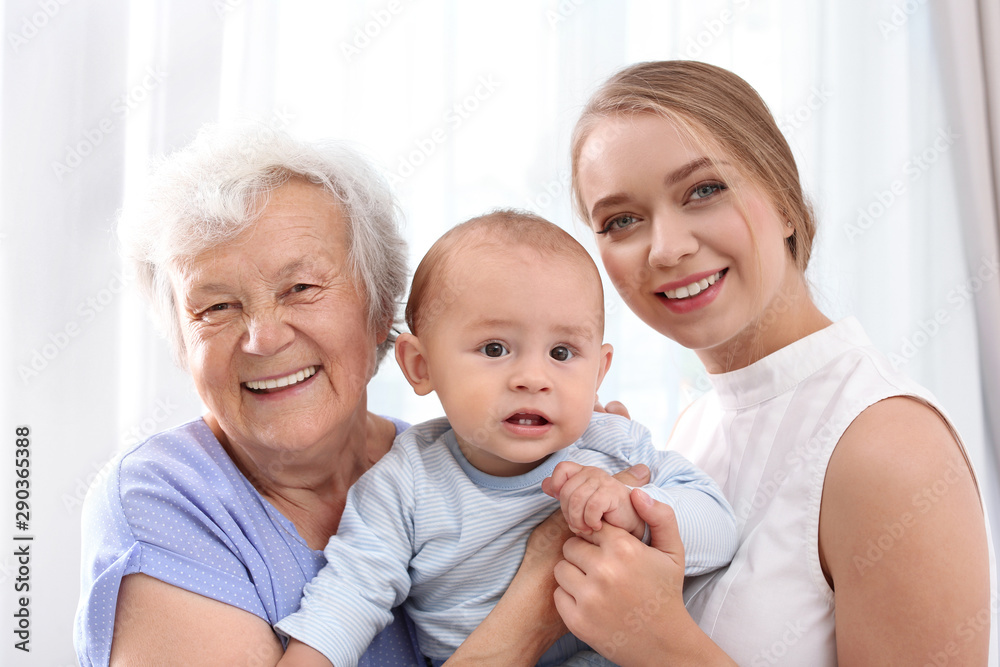 Happy young woman with her child and grandmother at home Happy young woman with her child and grandmother at home